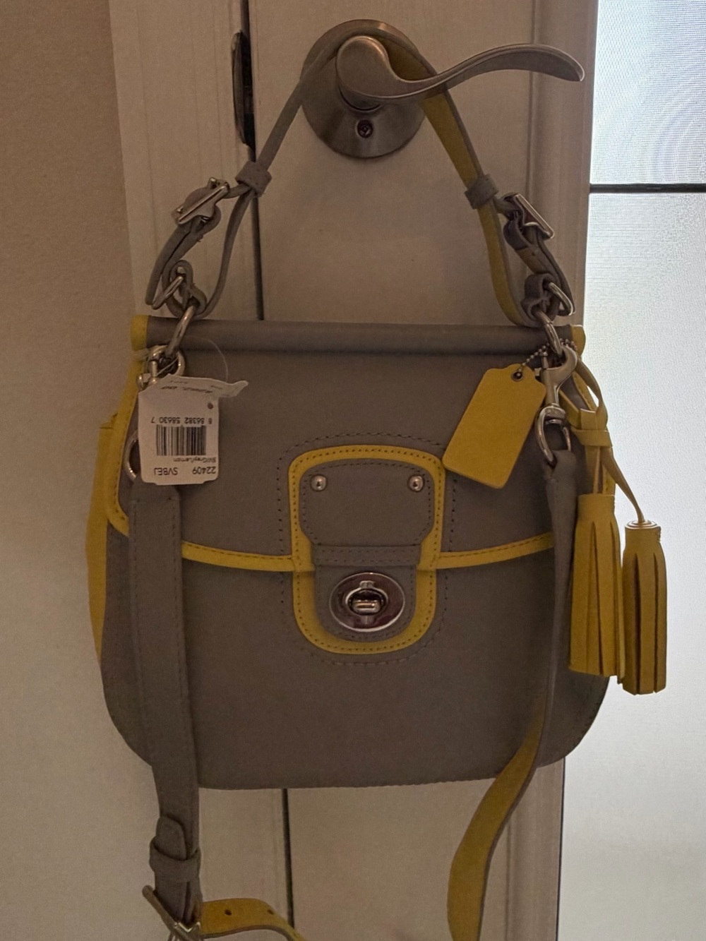 Coach Brand new Gray and Yellow Leather Crossbody Bag with Tassel